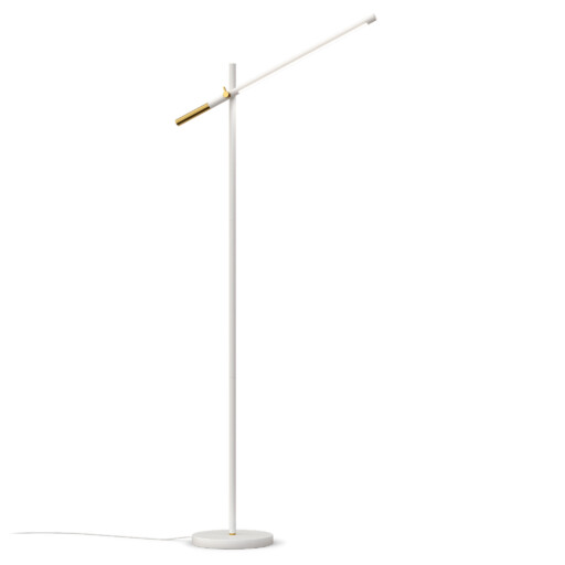 valkoinen piano lattiavalaisin valo päällä